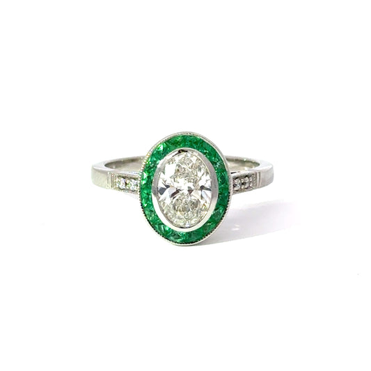 Platinum GIA certified Oval Diamond and Emerald Ring